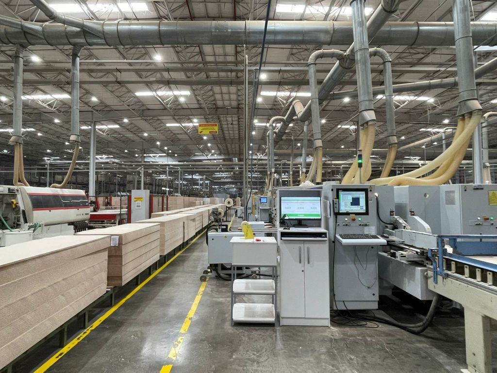 Modern furniture manufacturing facility in Brazil with advanced machinery and automated wood processing lines — Vista Furniture Co. connecting global retailers to high-quality Brazilian suppliers.