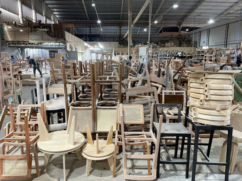 Brazilian furniture factory producing hardwood chairs and wooden furniture using certified timber and artisanal woodworking techniques.