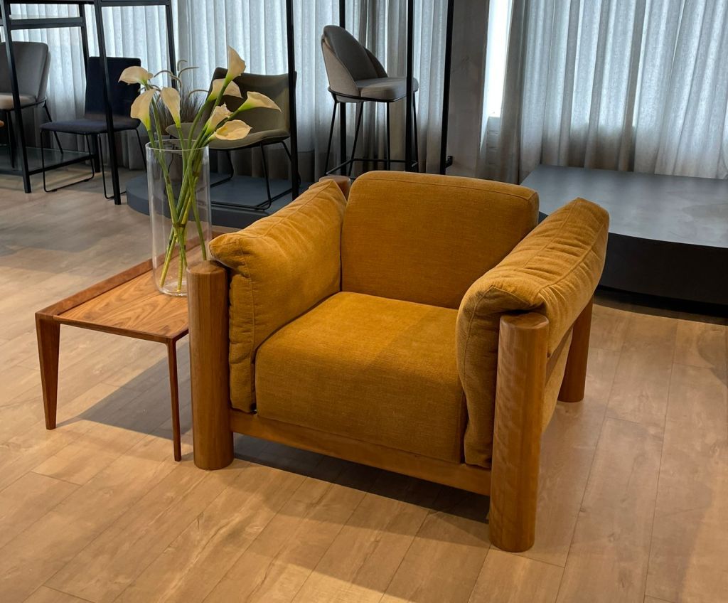 Premium upholstered armchair manufactured in Brazil demonstrating material stability, solid wood construction, and export-ready furniture quality standards.